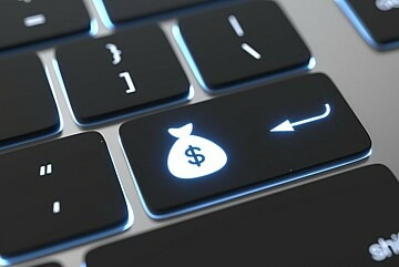 Tastatur mit Geldsack auf einer Taste